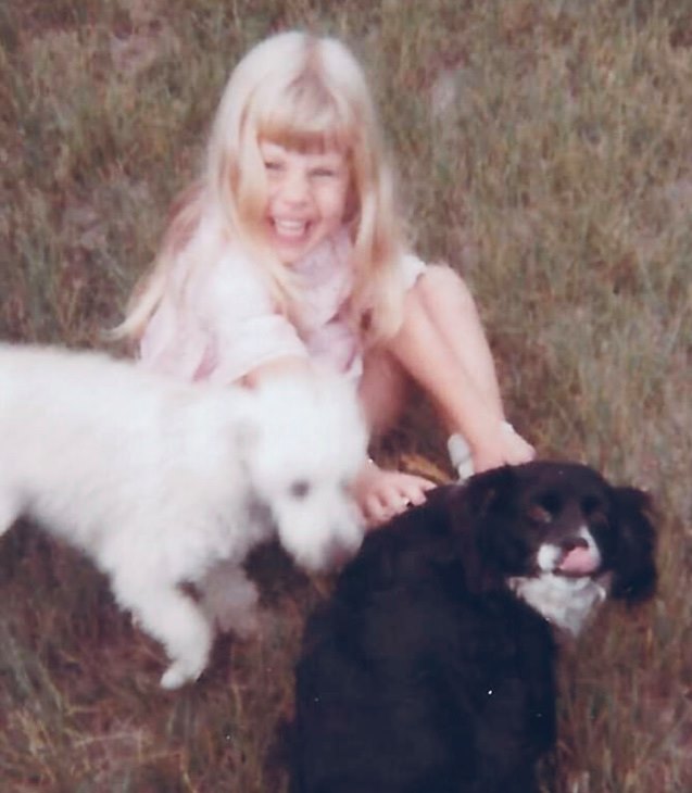 Shannon as a child with her dogs